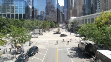 New York City, United States - 31 Aug 2023: Manhattan Downtown Financial District Liberty street crossroad intersection. Urban road car traffic. People pedestrian. World Trade Center memorial area. clipart