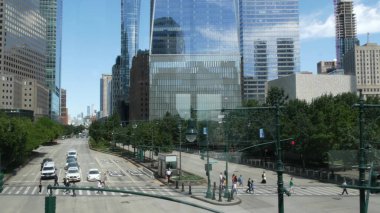 New York City, United States - 31 Aug 2023: Manhattan Downtown Financial District street crossroad intersection. Urban road car traffic. People pedestrian on zebra. World Trade Center memorial area. clipart