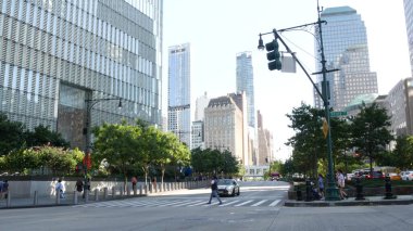 New York City, United States - 31 Aug 2023: Manhattan Downtown Financial District street crossroad intersection. Urban road car traffic. People pedestrian. World Trade Center memorial area. clipart