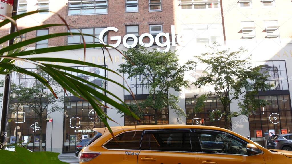 New York City, United States - 1 Sept 2023: Manhattan Midtown street or avenue. Urban red brick architecture USA. Google logo. Headquarters office near Chelsea Market, High Line. Yellow taxi cab car.