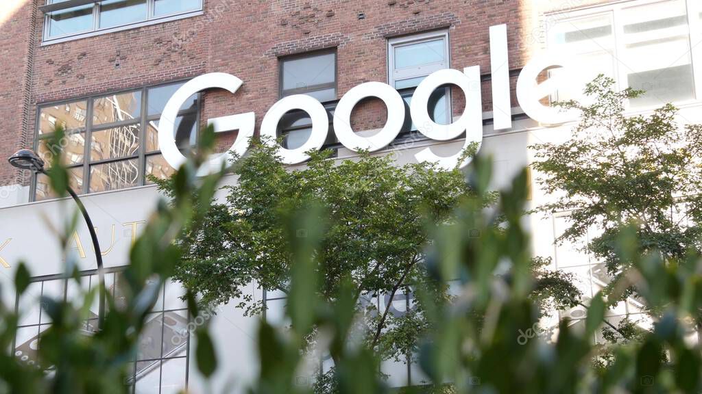 New York City, United States - 1 Sept 2023: Manhattan Midtown street or avenue. Urban red brick architecture USA. Google logo, logotype sign. NYC headquarters office near Chelsea Market and High Line.