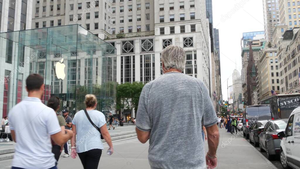 New York City, United States - 11 Sept 2023: Manhattan Midtown, Fifth 5 avenue, 5th ave near Central Park, Pulitzer Plaza, USA. American urban street, people pedestrian. Apple Store near Plaza Hotel.