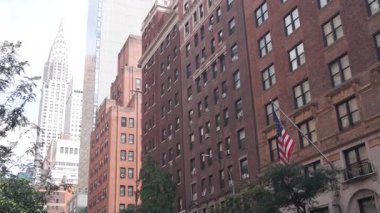 New York City Manhattan Midtown 42 sokak mimarisi. Chrysler binası, ikonik gökdelen, Lex Lexington Bulvarı, ABD. Amerikan kentsel konutları kırmızı tuğlalı ev, NYC kulesi, ABD.