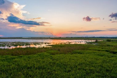 Aerial view of Mobile Bay and Daphne, AL at sunset in September 2022