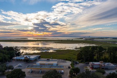 Aerial view of Daphne, AL and Mobile Bay at sunset in October 2022