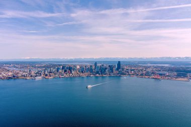 Aerial view of Seattle, Washington and Elliot Bay on a sunny day in March 2023 clipart