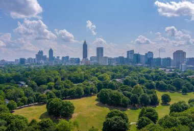 The Midtown Atlanta, Georgia skyline from Piedmont Park on a sunny day clipart