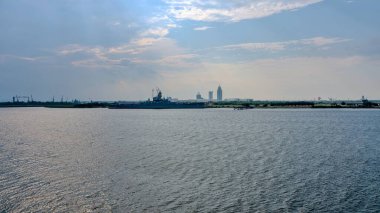 Aerial view of Mobile Bay and the downtown skyline in August clipart