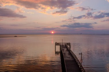 Bayfront Park pier at sunset on the Eastern shore of Mobile Bay in Daphne, Alabama clipart