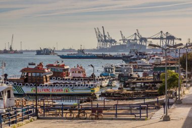 PORT SAID, EGYPT - FEBRUARY 3, 2019: Boats in the Suez canal in Port Said, Egypt clipart