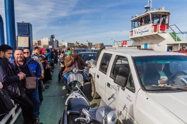 PORT SAID, EGYPT - FEBRUARY 3, 2019: Deck of Port Said - Port Fuad ferry across the Suez canal, Egypt clipart