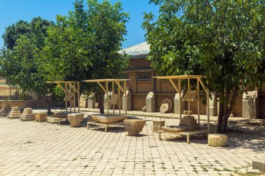 HAMADAN, IRAN - JULY 14, 2019: Exhibits of the archeological museum at Hegmataneh hill in Hamadan, Iran clipart