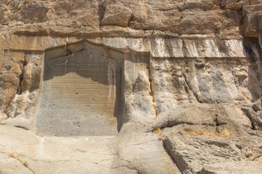 BISOTUN, IRAN - JULY 13, 2019: Safavid inscription in Mithradata (Mithridates) II and Godarz (Gotarzes) II reliefs in Bisotun, Iran