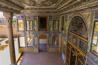 SHIRAZ, IRAN - JULY 8, 2019: Mirrored entrance hall of Qavam House in Naranjestan garden in Shiraz, Iran