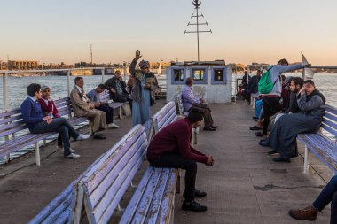 LUXOR, EGYPT - FEB 18, 2019: Passengers of a ferry across the river Nile in Luxor, Egypt