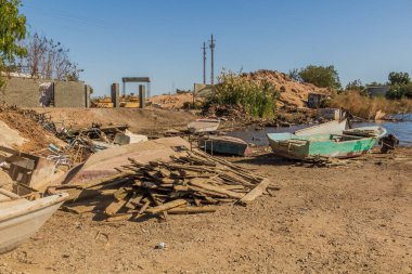 Broken boats at the Aswan High Dam reservoir from the dam, Egypt