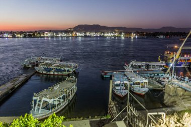 LUXOR, EGYPT - FEB 18, 2019: Evening view of boats at the river Nile in Luxor, Egypt