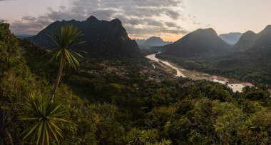 Evening aerial view of Muang Ngoi Neua village and Nam Ou river from Phanoi viewpoint, Laos clipart