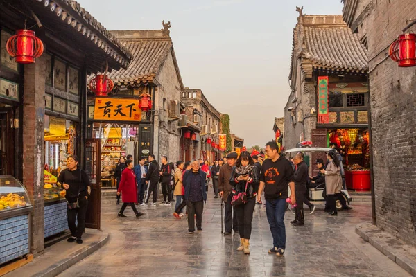 stock image PINGYAO, CHINA - OCTOBER 20, 2019: People on a street in Pingayo Ancient City, China