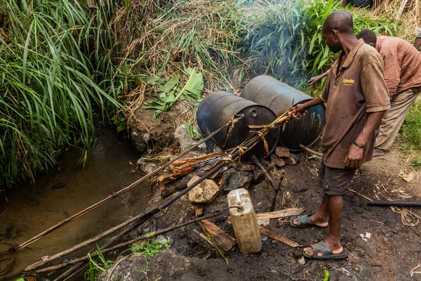 stock image KIBUGA, UGANDA - MARCH 13, 2020: Rural banana alcohol distillery near Kibuga village in the crater lakes region near Fort Portal, Uganda