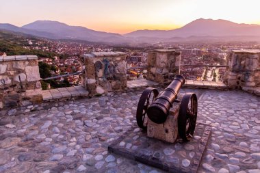 Evening view of a cannon at Kalaja fortress in Prizren, Kosovo clipart