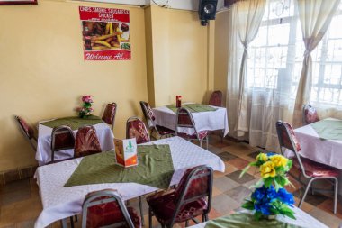 KAKAMEGA, KENYA - FEBRUARY 23, 2020: Dining room of Kakamega Guest House, Kenya clipart