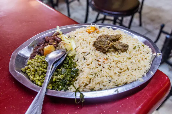 Typical meal in Kenya - rice, beans and sukuma wiki