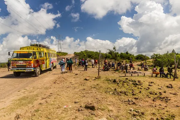 stock image MARALAL, KENYA - FEBRUARY 13, 2020: Local bus on a rural road near Maralal, Kenya