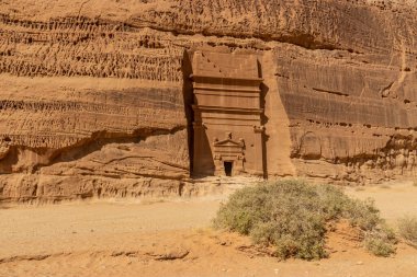 Rock cut tomb 45 in Jabal Al Banat hill at Hegra (Mada'in Salih) site near Al Ula, Saudi Arabia clipart