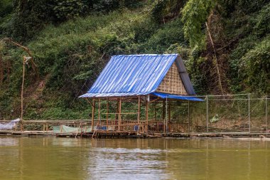 Floating house at Nam Ou river, Laos clipart