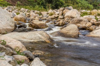 Nyamwamba river in Kilembe village, Uganda clipart