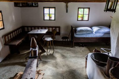 ROZNOV POD RADHOSTEM, CZECH REPUBLIC - JULY 15, 2021: Interior of an old house in the open air museum (Valasske muzeum v prirode) in Roznov pod Radhostem, Czechia clipart