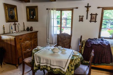 ROZNOV POD RADHOSTEM, CZECH REPUBLIC - JULY 15, 2021: Interior of an old house in the open air museum (Valasske muzeum v prirode) in Roznov pod Radhostem, Czechia clipart