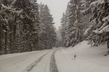 Winter view of I/11 road near Suchy vrch mountain, Czech Republic clipart