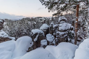 Winter view of snow covered Prachovske skaly rocks in Cesky raj (Czech Paradise) region, Czech Republic clipart