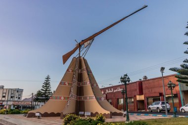 DHAHRAN AL JANUB, SAUDI ARABIA - NOVEMBER 25, 2021: Monument of a rifle in Dhahran al Janub, Saudi Arabia clipart