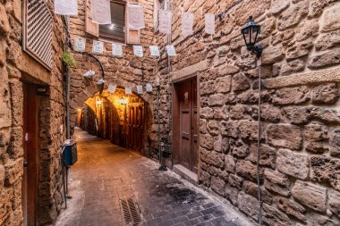 SIDON, LEBANON - 23 JULY, 2022: Narrow alley in the old town of Sidon, Lebanon clipart