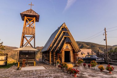 DRVENGRAD, SERBIA - OCTOBER 5, 2021: Wooden Church of Saint Sava in Drvengrad (Kustendorf) settlement near Mokra Gora, Serbia clipart