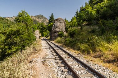 Narrow gauge Odontotos railway in Vouraikos Gorge on Peloponnese peninsula, Greece. clipart