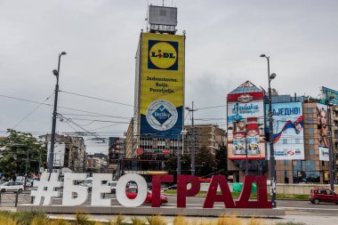 BELGRADE, SERBIA - OCTOBER 8, 2021: Sign Beograd (Belgrade in cyrilic) on Trg Slavija square in Belgrade, Serbia clipart