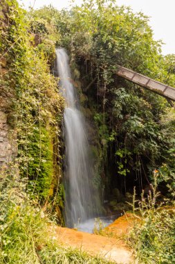 Artificial waterfall in the Open air water power Museum near Dimitsana village on Peloponnese peninsula, Greece clipart