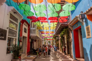 CARTAGENA, COLOMBIA - MARCH 5, 2023: Magdalena street in Getsemani neighborhood of Cartagena de Indias, Colombia clipart