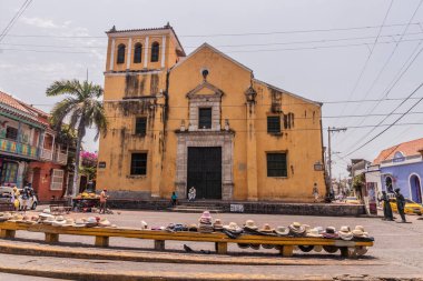 CARTAGENA, COLOMBIA - MARCH 5, 2023: Trinidad church and Trinidad square in Getsemani neighborhood of Cartagena de Indias, Colombia clipart