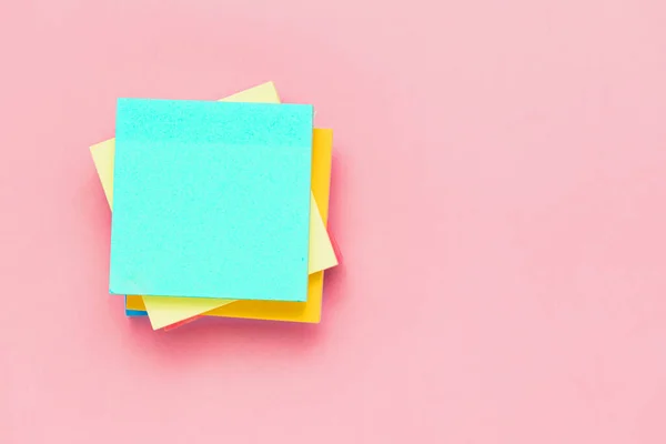 stock image Top view of sticky paper notes on pink background for office and school stationary concept