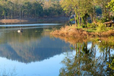 fisherman sitting on a boat