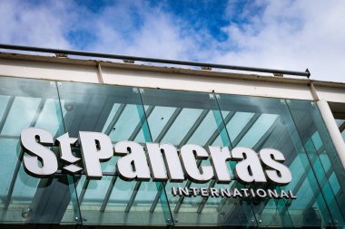 St. Pancras International station, exterior view of the sign with sun glaring. London, United Kingdom, 3rd of June 2024. High quality photo clipart