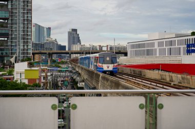 Samut Prakan-Thailand Aug 29, 2024: BTS Sky train runs to Bangna Station in day time. BTS Bangna Station can connect to BITEC Exhibition Center clipart