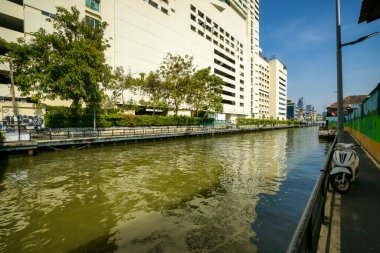 Bangkok, Thailand - January 19, 2025 : The atmosphere on both sides of the Saen Saep Canal, a canal where passenger boats take passengers into the center of Bangkok. clipart