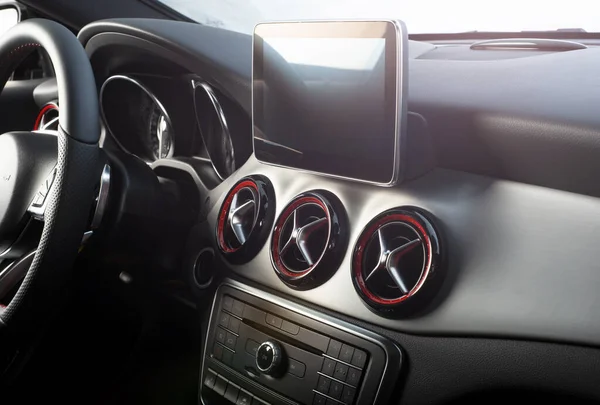 Dark luxury car Interior - steering wheel shift lever and dashboard  Car inside Beige comfortable seats steering wheel dashboard climate control speedometer display