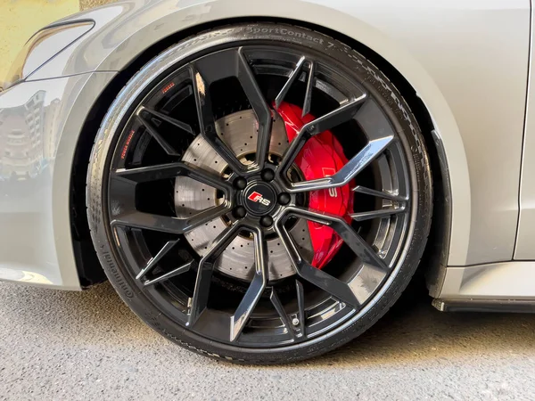 stock image Yerevan, Armenia, 03.22.2023: New AUDI RS7 quattro black wheel with red breaks parked on the street